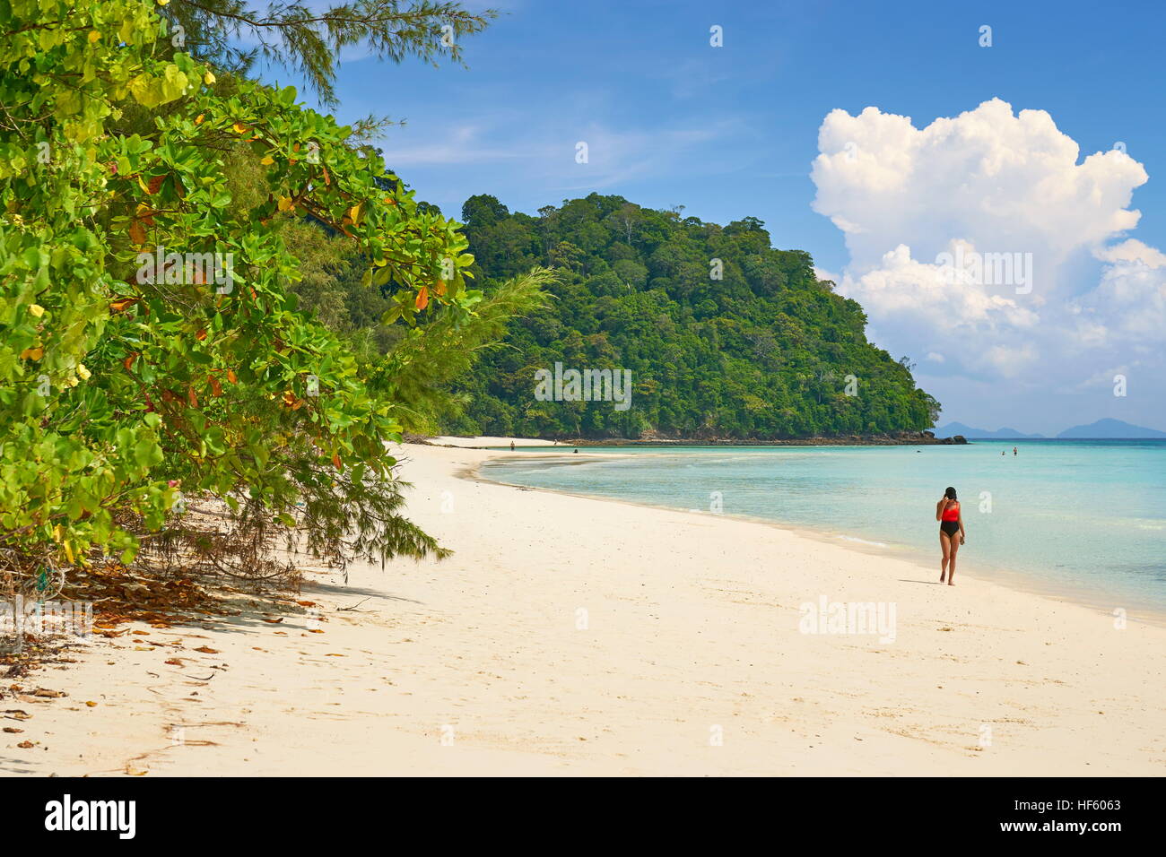 Young gilrl walking on the beach, Bu Bu Island, Krabi Province, Thailand Stock Photo