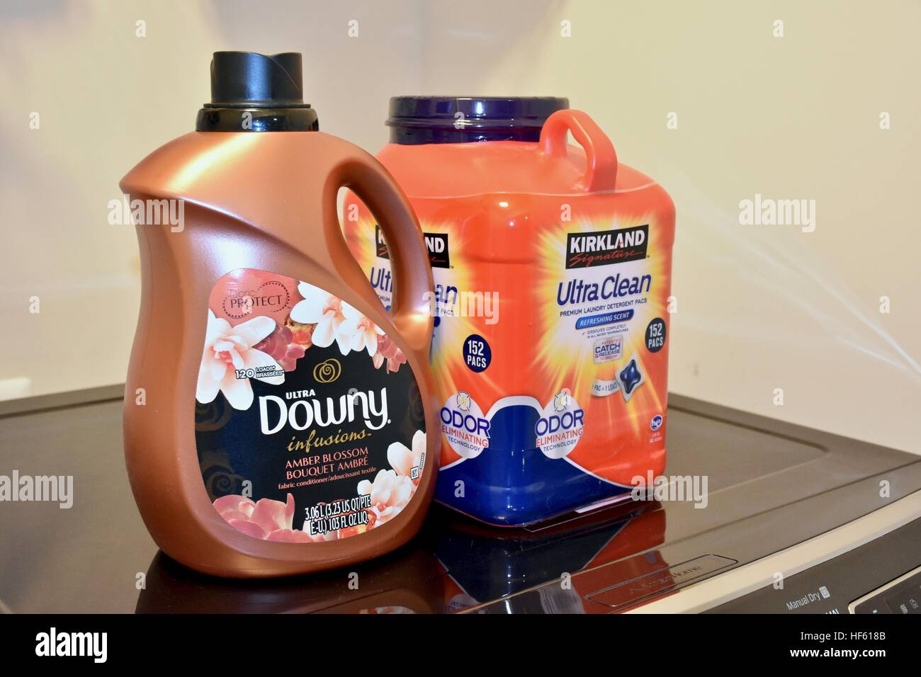 Washing machine pods and fabric softener sitting on top of the washer