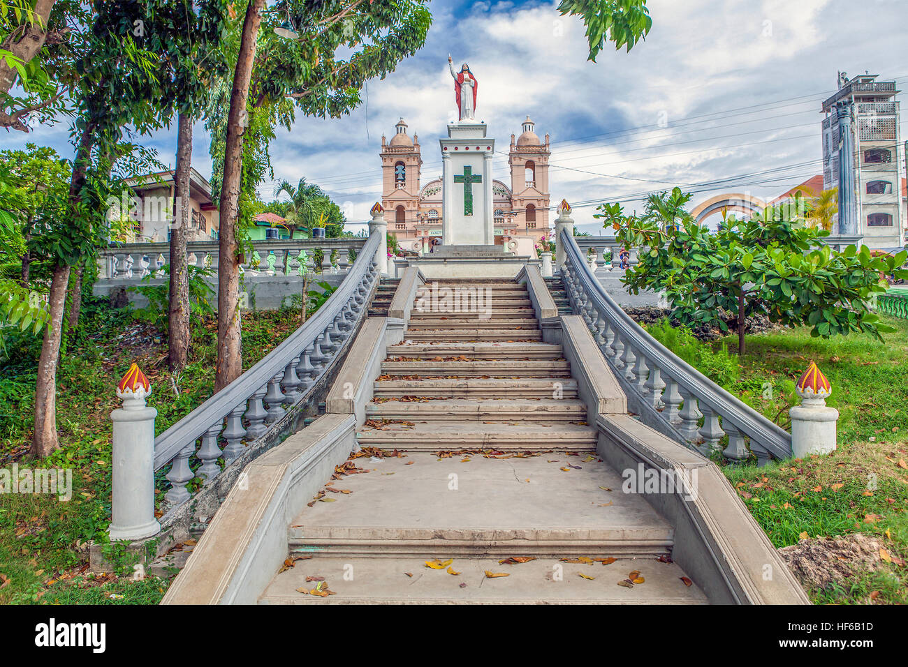 Statue of Jesus Christ at the head of concrete stairway in Bogo City, Philippines. Stock Photo