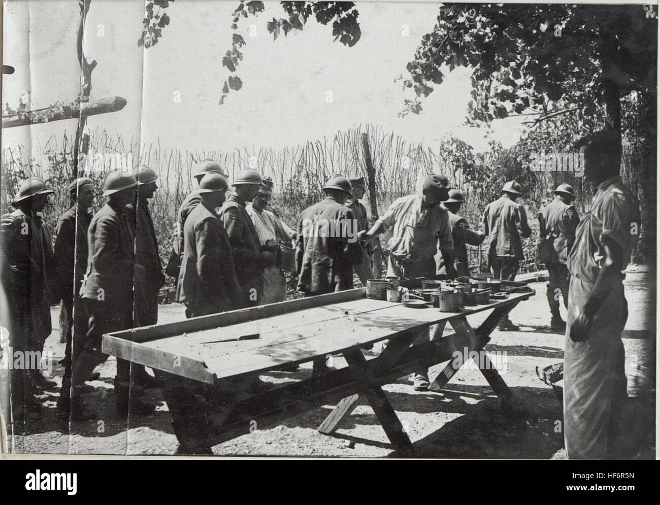 A photograph showing the distribution of rations to Italian prisoners ...