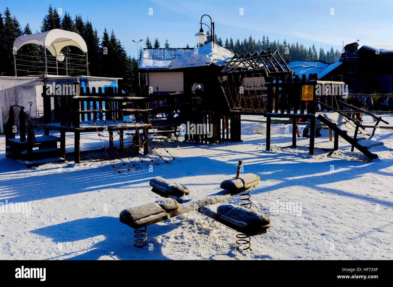 Children's swings and slides in the snow in the winter Stock Photo