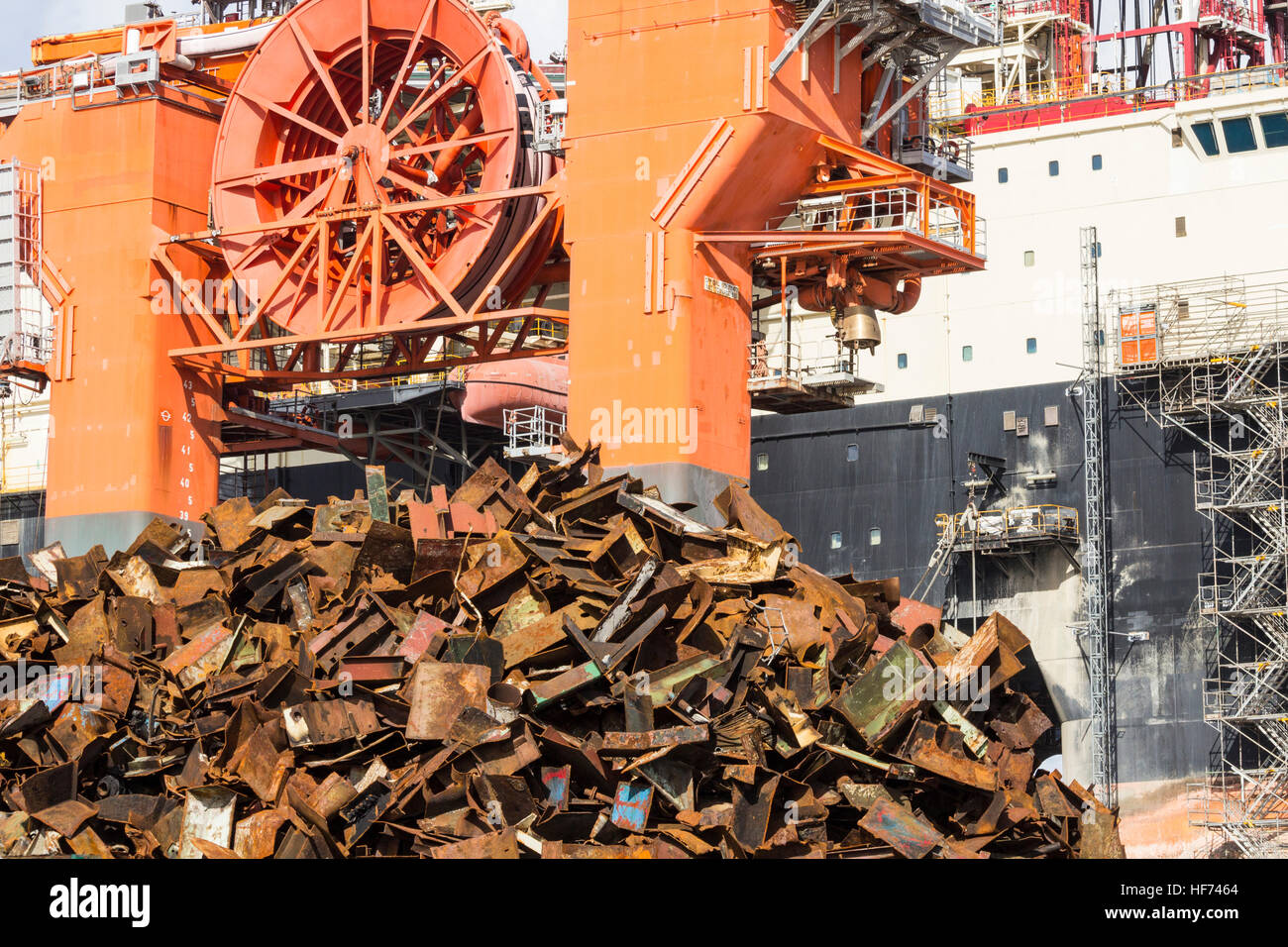 Scrap metal from ship broken up for recycling in port scrapyard in Spain. Stock Photo