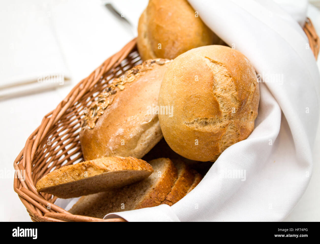 Wicker basket of freshly baked dinner rolls Stock Photo Alamy