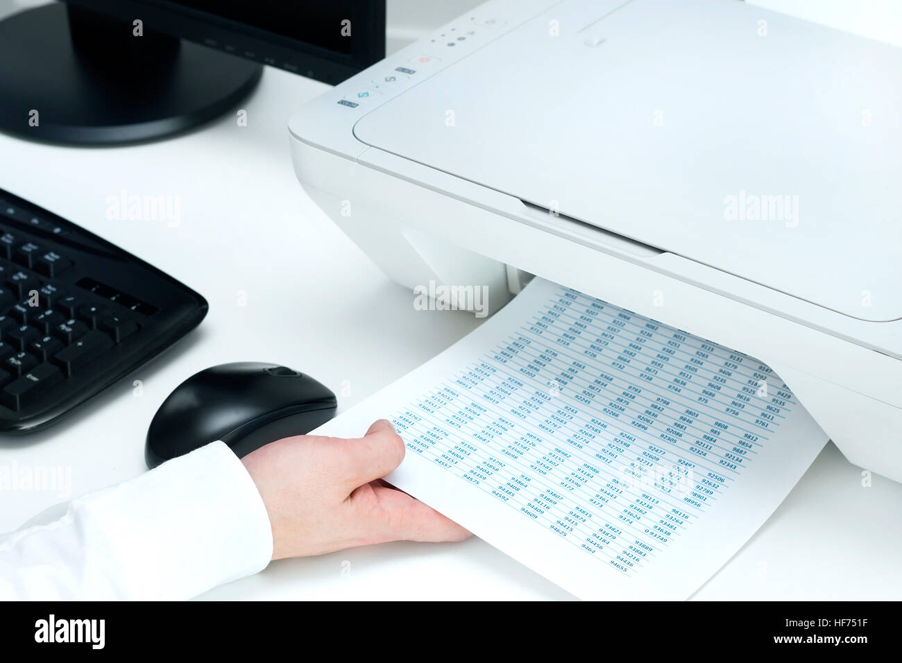 Man takes out some documents from printer Stock Photo Alamy