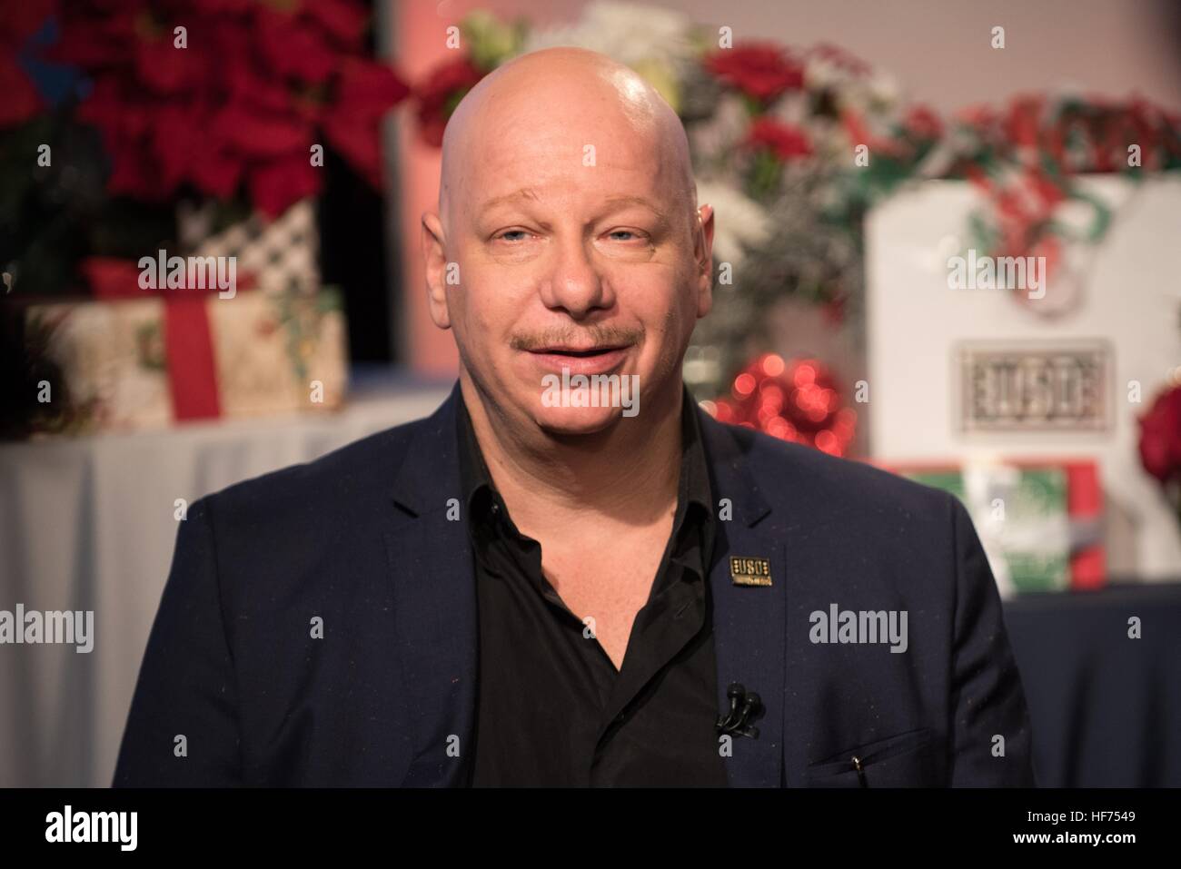 Comedian Jeff Ross speaks about his upcoming USO Tour to the Middle East to visit U.S. troops during a television interview at the National Press Club December 23, 2016 in Washington, DC. Stock Photo