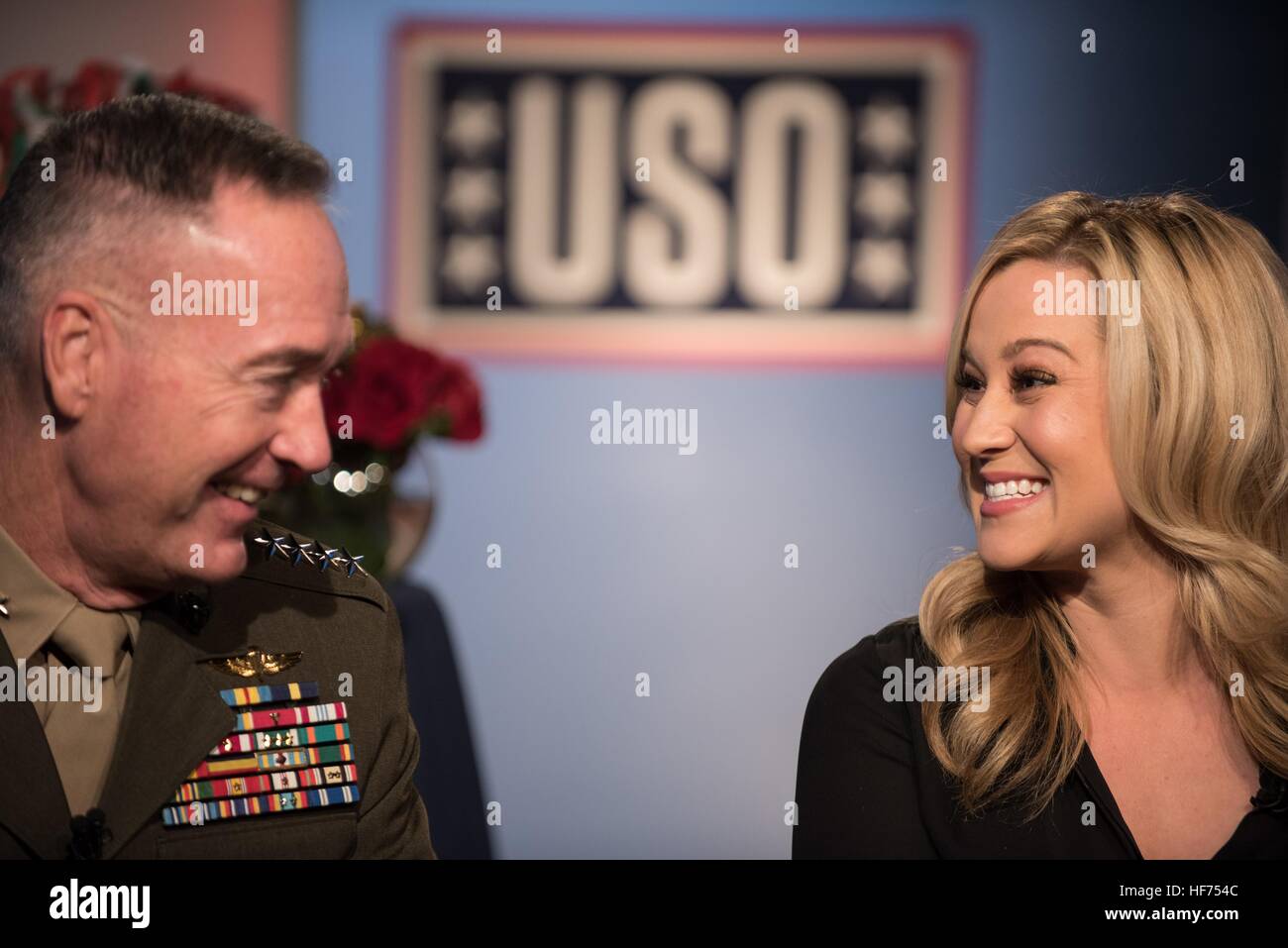 U.S. Joint Chiefs of Staff Chairman Joseph Dunford and country music singer Kellie Pickler talk about their upcoming USO Tour to the Middle East to visit U.S. troops during a television interview at the National Press Club December 23, 2016 in Washington, DC. Stock Photo