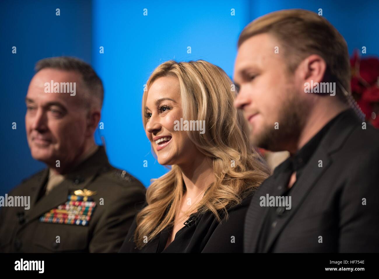 U.S. Joint Chiefs of Staff Chairman Joseph Dunford (left), country music singer Kellie Pickler, and husband country music songwriter Kyle Jacobs speak about their upcoming USO Tour to the Middle East to visit U.S. troops during television and radio interviews at the National Press Club December 23, 2016 in Washington, DC. Stock Photo
