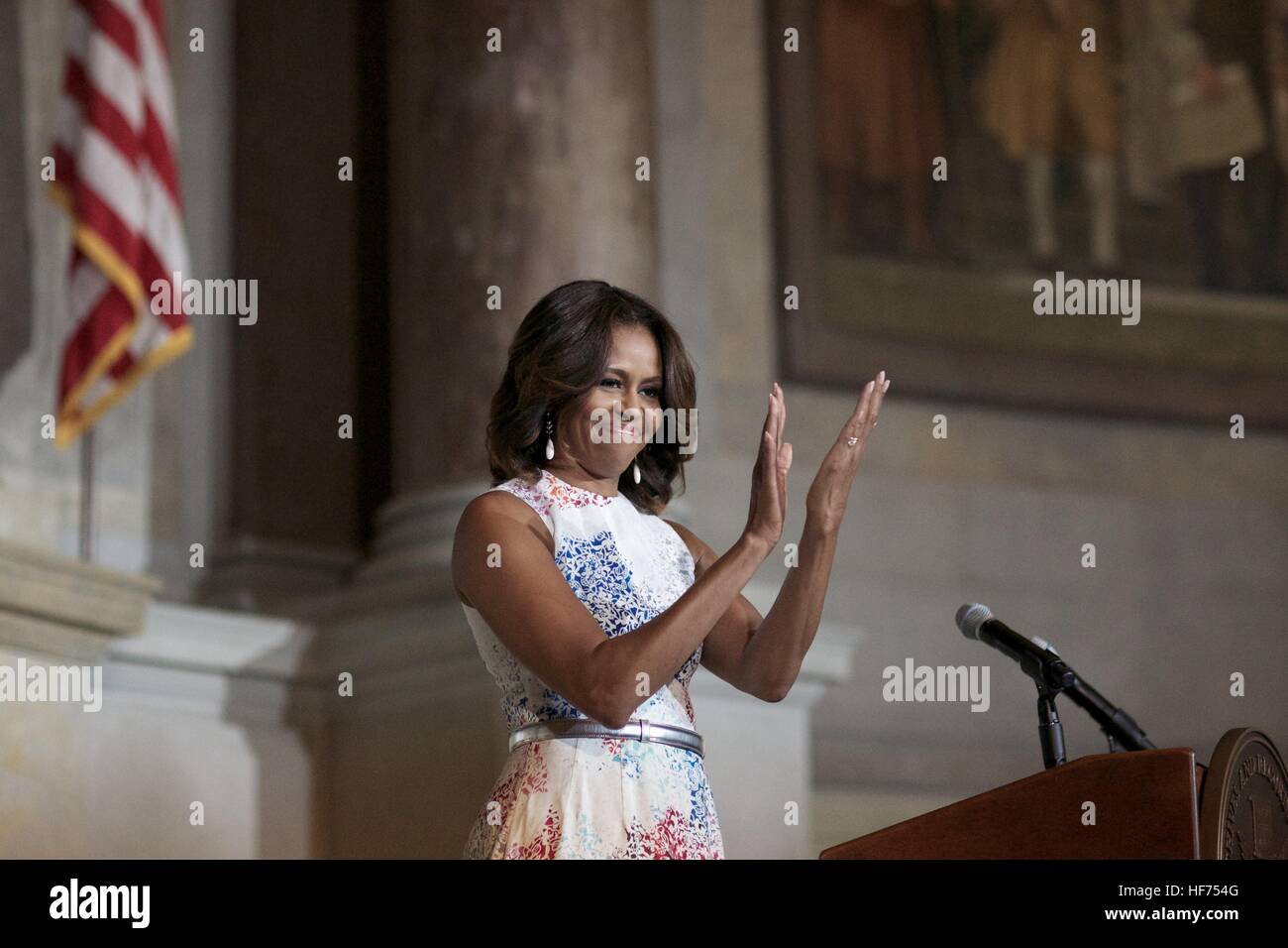 U.S. First Lady Michelle Obama speaks during a naturalization ceremony for 50 new American citizens at the National Archives June 18, 2014 in Washington, DC. Stock Photo