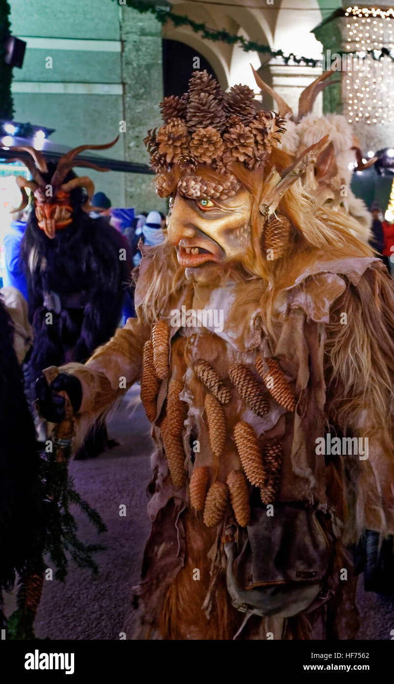 SALZBURG, AUSTRIA DECEMBER 21 A wooden mask wearing person walks