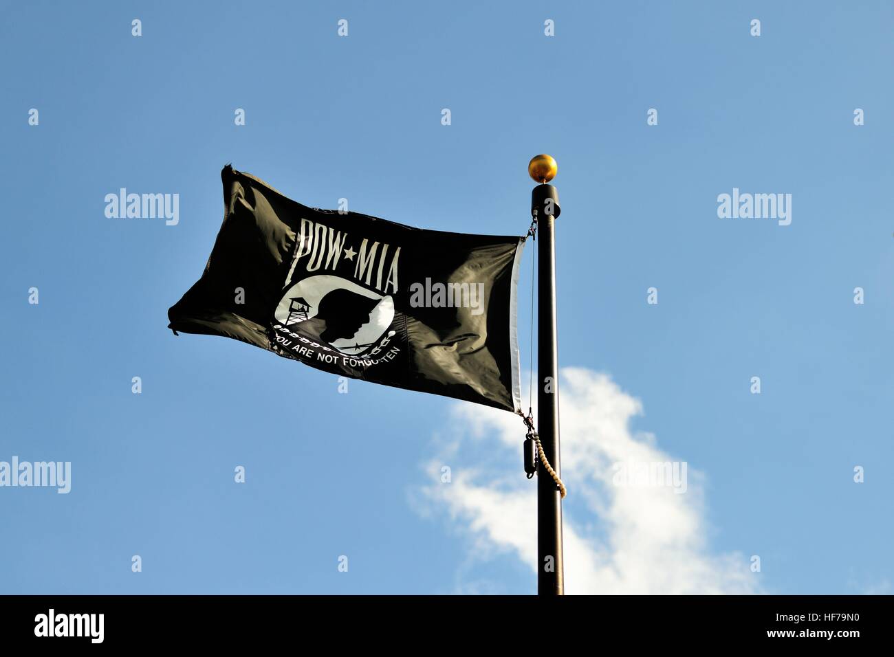 A POW-MIA flag flying above a veterans memorial in Elgin, Illinois. Stock Photo