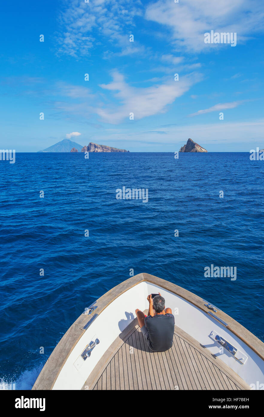Boat sailing at Basiluzzo Cliff, Panarea, Aeolian Islands, Sicily, Italy, Europe, Stock Photo