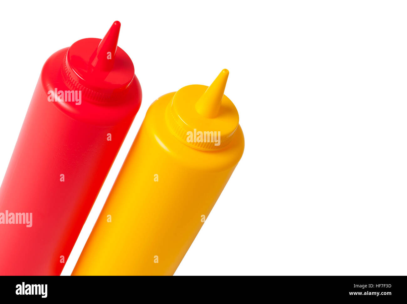 Catsup and Mustard condiment bottles in red and yellow, isolated over