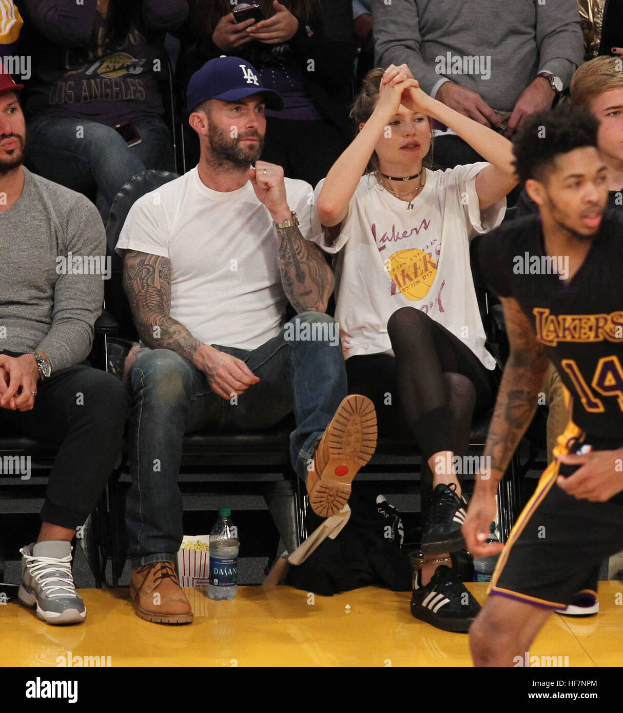 Celebrities at the Los Angeles Lakers game. The Golden State Warriors defeated the Los Angeles Lakers by the final score of 109-85 at the Staples Center in Los Angeles  Featuring: Adam Levine, Behati Prinsloo Where: Los Angeles, California, United States Stock Photo
