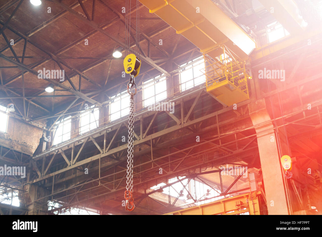 Chain hanging from crane in steel factory Stock Photo