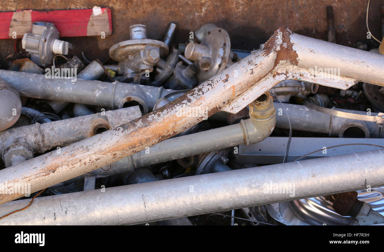 rusty iron pipes and other ferrous material in a landfill Stock Photo ...