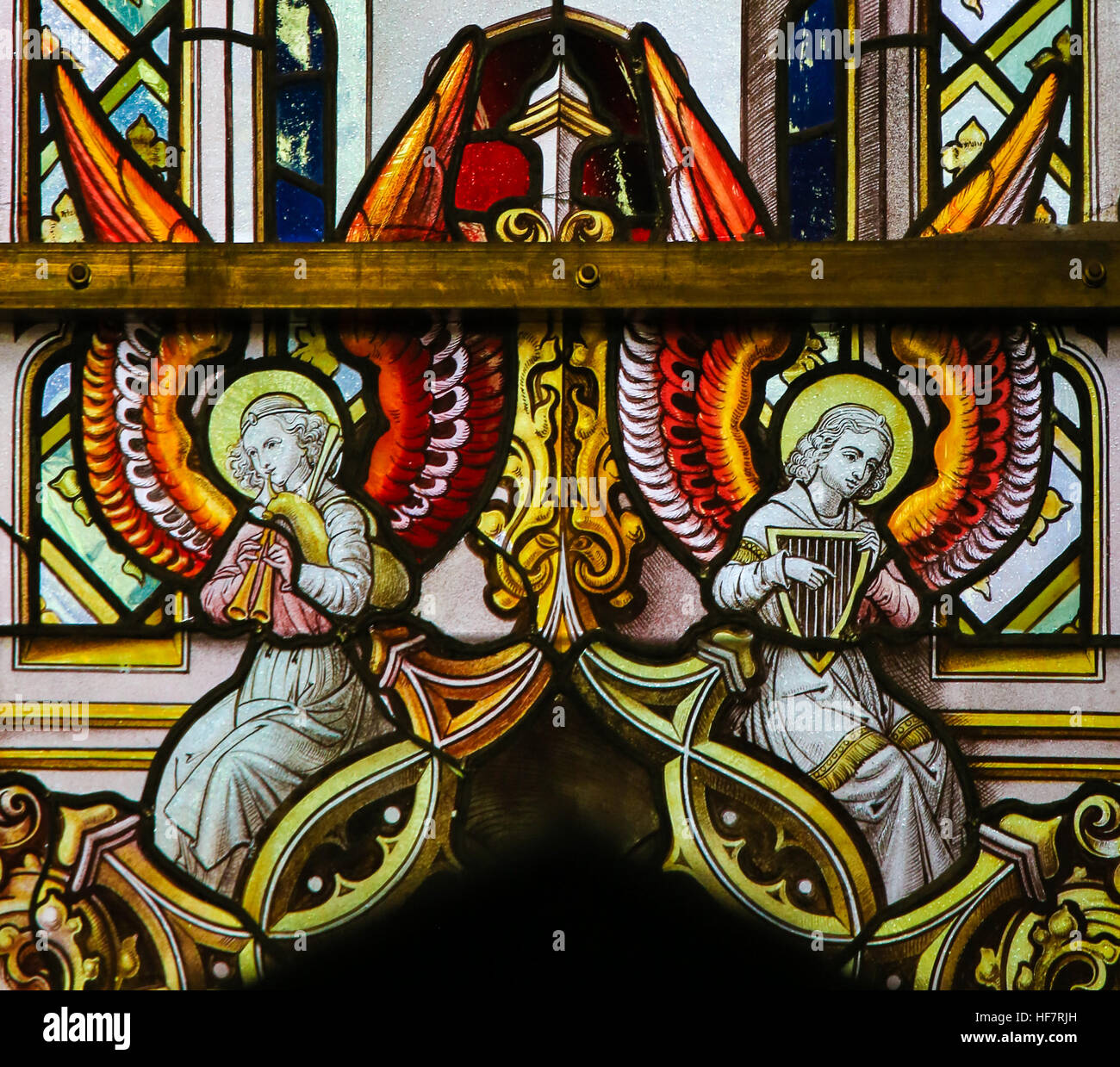 Stained Glass depicting Angels playing a bagpipe and a Celtic harp