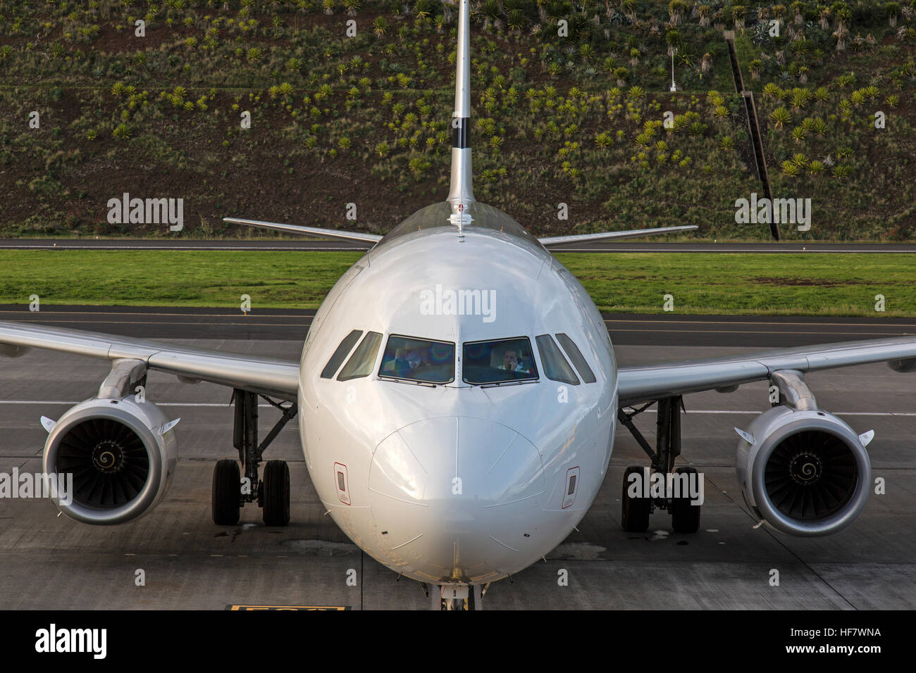 Front view of an airliner at Funchal Airport on the island of Madeira. Aircraft is unbranded. Stock Photo