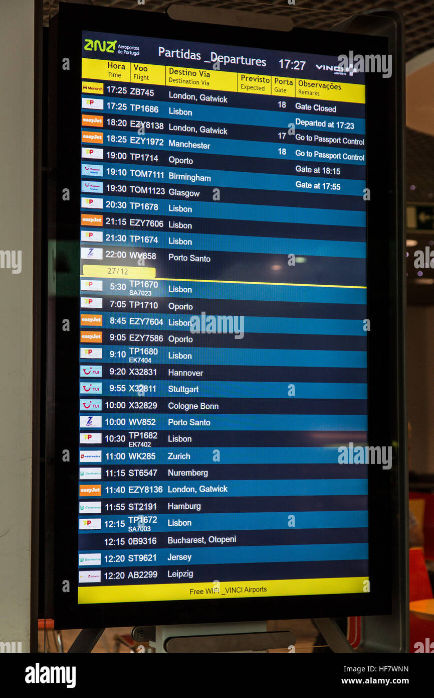 Departures board in Funchal Airport on the island of Madeira. Stock Photo