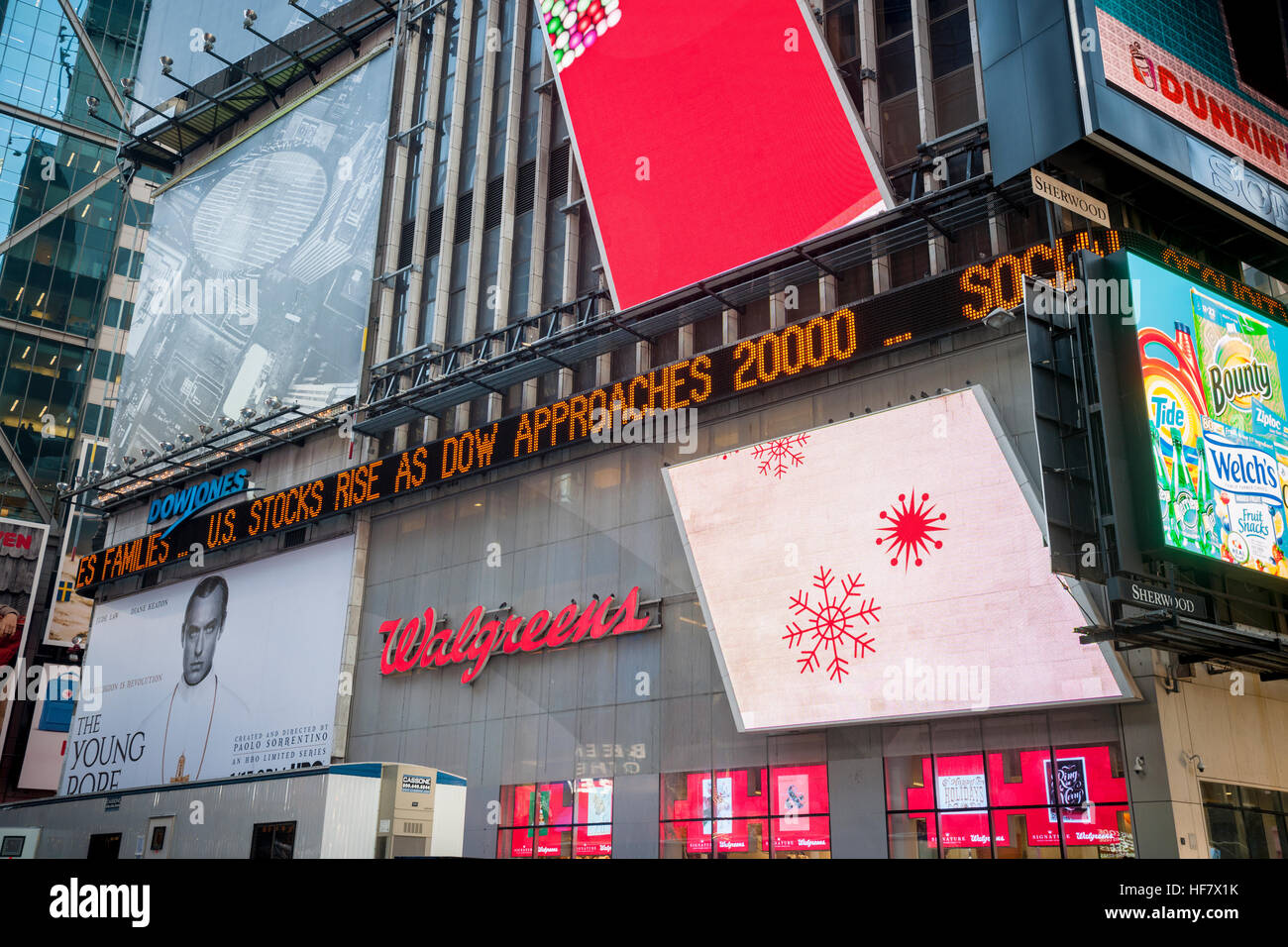 The news ticker in Times Square in New York on Tuesday, December 20, 2016 informs readers that the Dow Jones Industrial Average approached 20,000. (© Richard B. Levine) Stock Photo