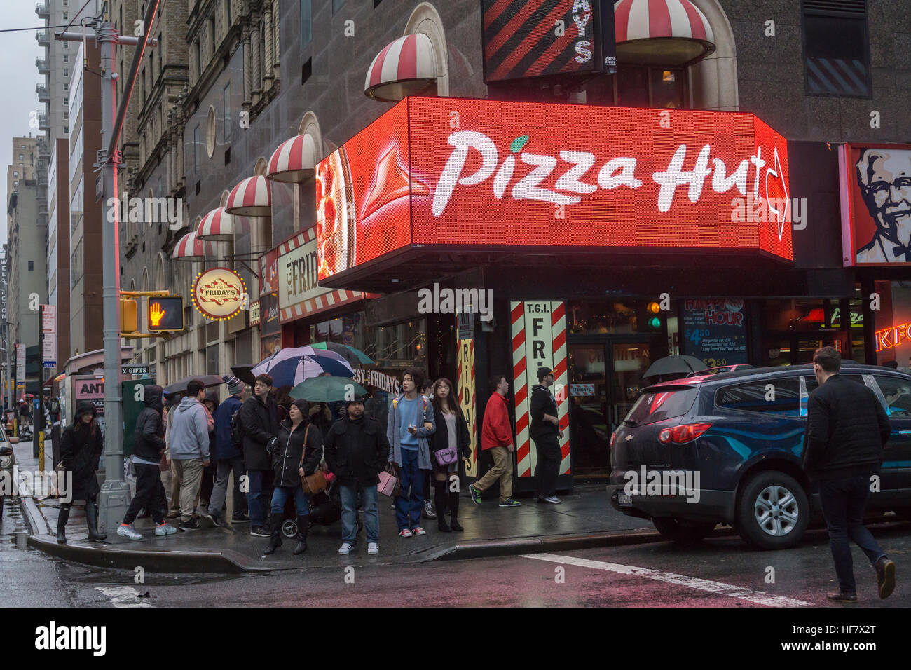 Advertising for Pizza Hut in a storefront in New York ...