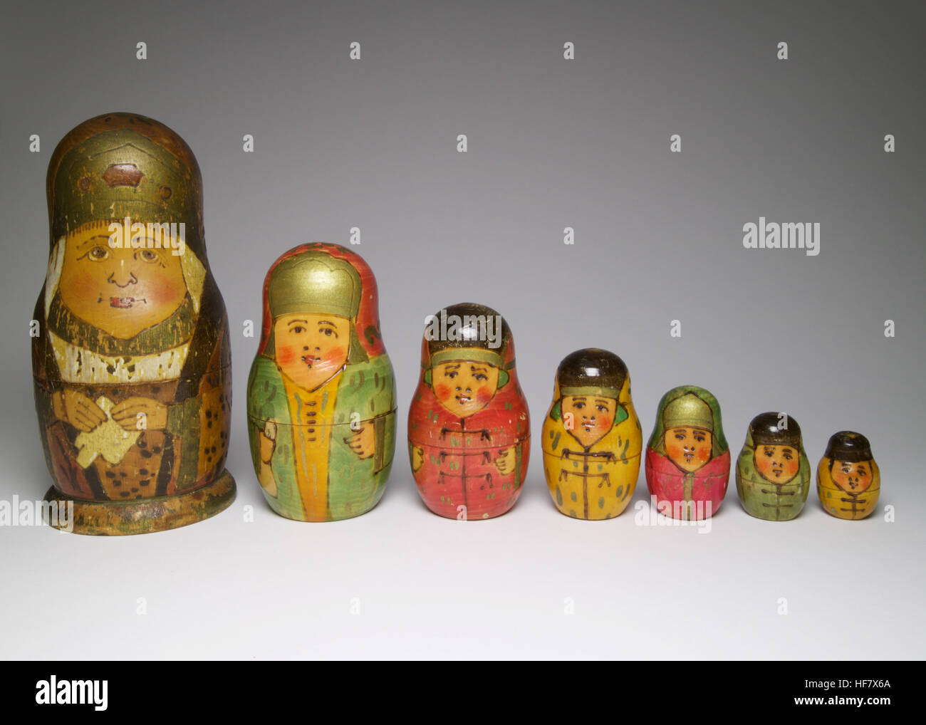 Set of 7 vintage Russian poker work and painted wooden dolls. The largest doll measures 18.5cm high Stock Photo