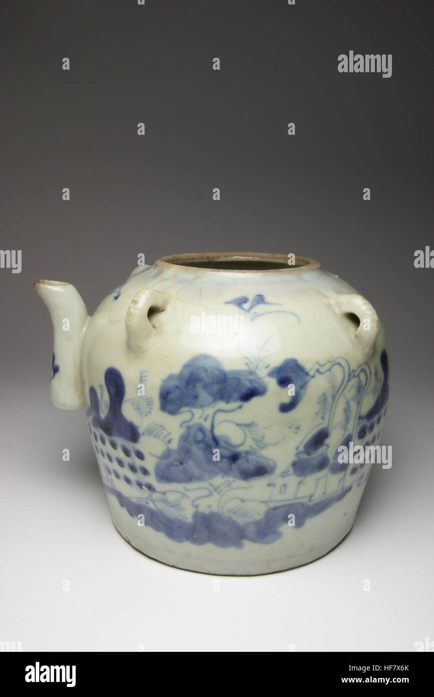 Antique Chinese blue and white porcelain wine pot painted with a house amongst trees and fields, the reverse with inscription, masks to the four loop Stock Photo