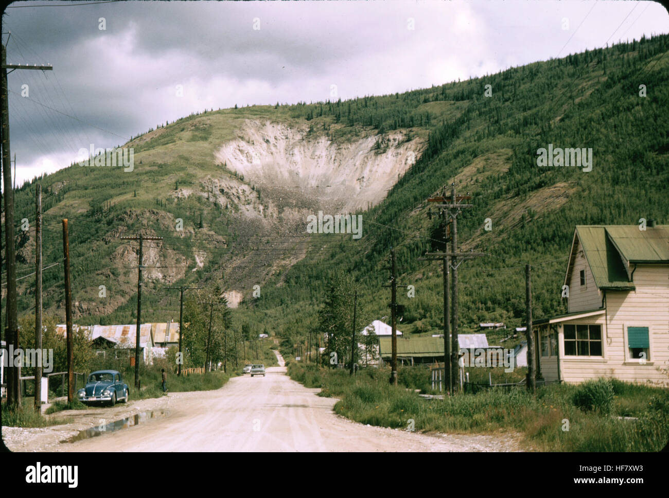 Streetscene and landslide at mountain side; Dawson, Yukon Territory, Canada. Stock Photo