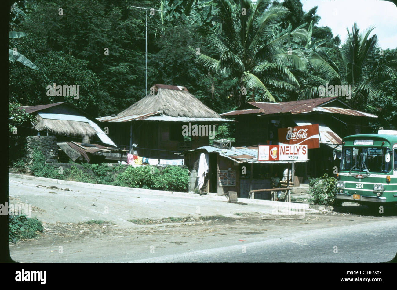 Small settlement near Manila; Luzon Island, Philippines.  Note thatched roof structures. Stock Photo