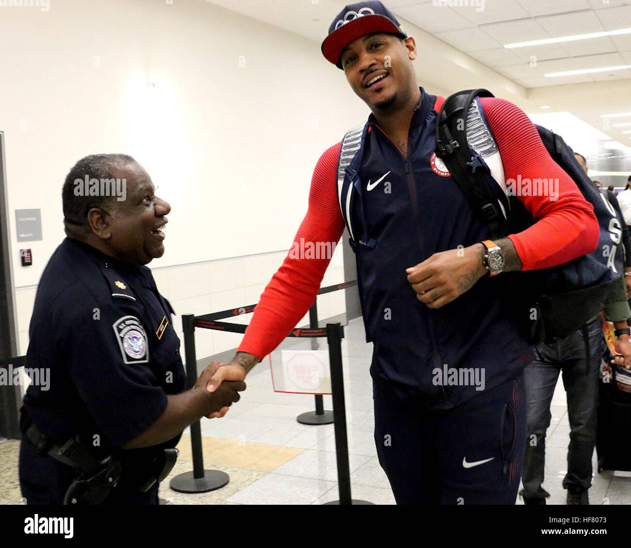 Olympic athletes, families and passengers were welcomed and cleared by U.S. Customs and Border Protection officers at Hartsfield Jackson Atlanta International Airport. Carmelo Anthony, center for the U.S. Olympic Men’s basketball team processes back into the United States from the Olympic games in Rio. Stock Photo