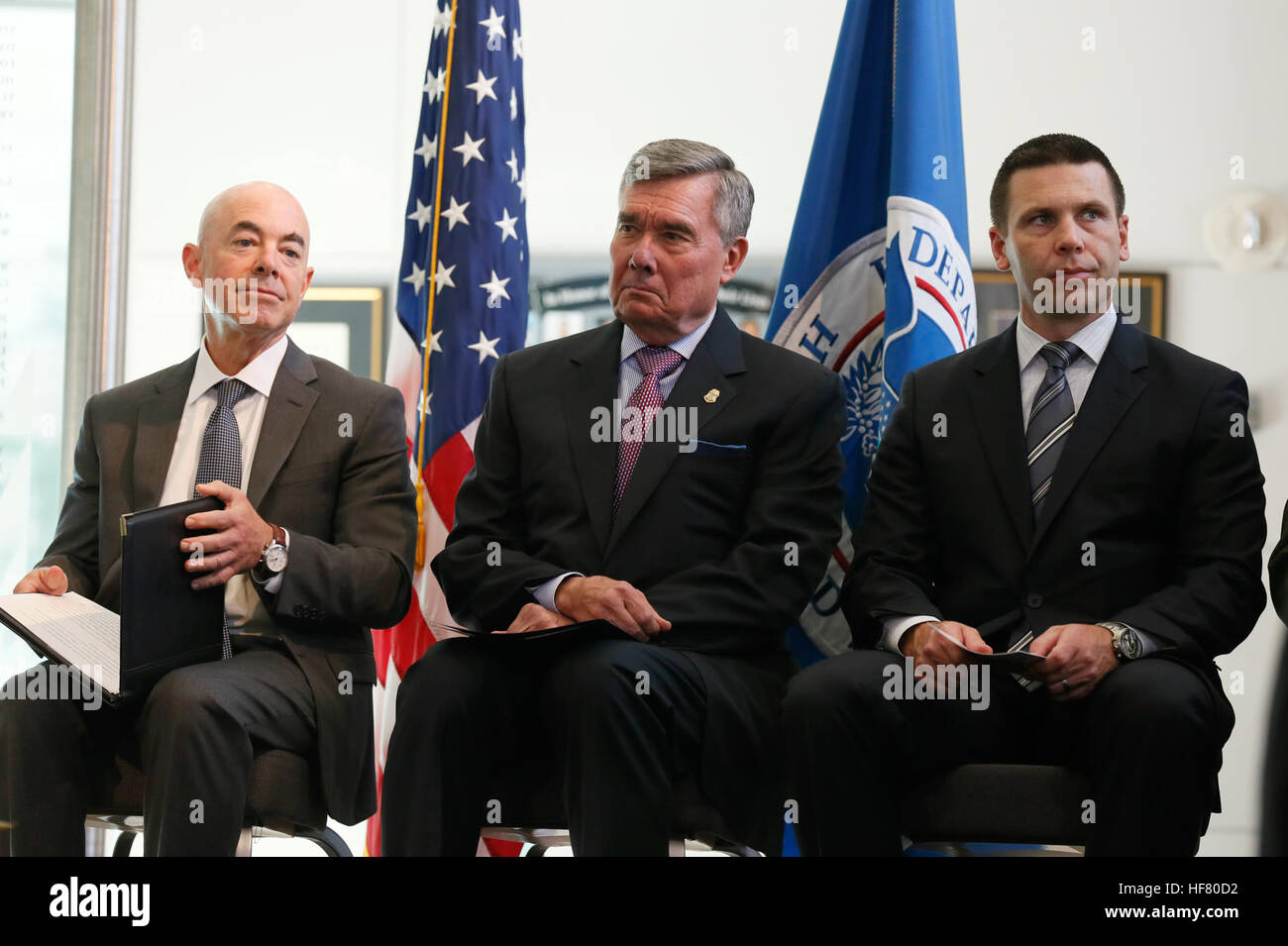 U.S. Customs and Border Protection Commissioner R. Gil Kerlikowske, center, is flanked by Deputy Secretary of Homeland Security Alejandro Mayorkas, left, and U.S. Customs and Border Protection Deputy Commissioner Kevin K. McAleenan, right, during a swearing-in ceremony for newly appointed Chief of U.S. Border Patrol Mark Morgan at the Ronald Reagan Building in Washington, D.C., October 11, 2016.  by Glenn Fawcett Stock Photo