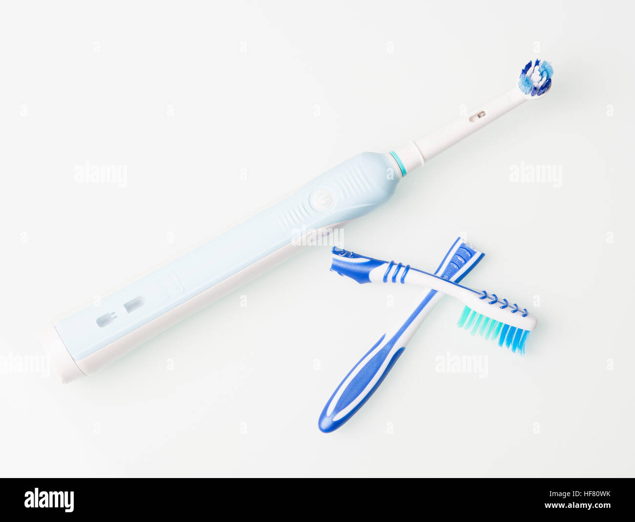 new electric toothbrush and broken old Stock Photo Alamy