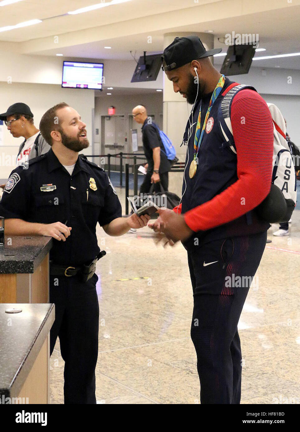 Olympic athletes, families and passengers were welcomed and cleared by U.S. Customs and Border Protection officers at Hartsfield Jackson Atlanta International Airport. DeMarcus Cousins, center for the U.S. Olympic Men’s basketball team processes back into the United States from the Olympic games in Rio. Stock Photo