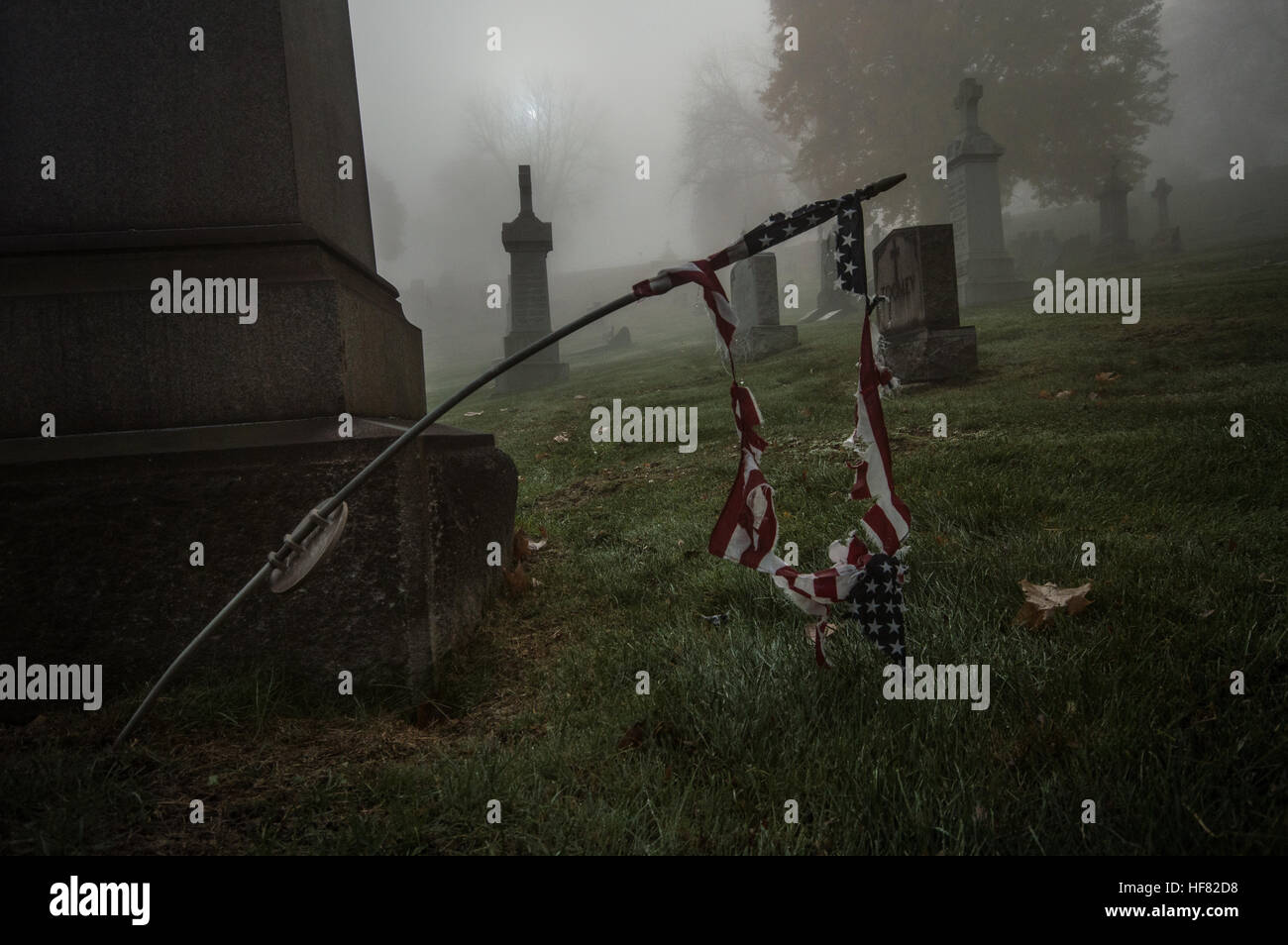 Decaying American flag at a cemetery in Pittsburgh, Pennsylvania. Stock Photo