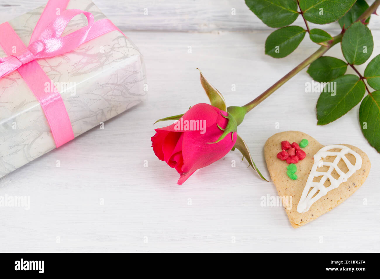 Rose hearth shaped cookie and a present box Stock Photo