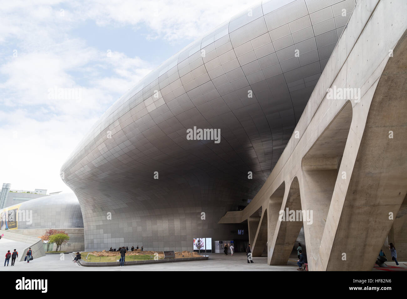People at the futuristic Dongdaemun Design Plaza (DDP) in Seoul, South Korea, in the daytime. Stock Photo