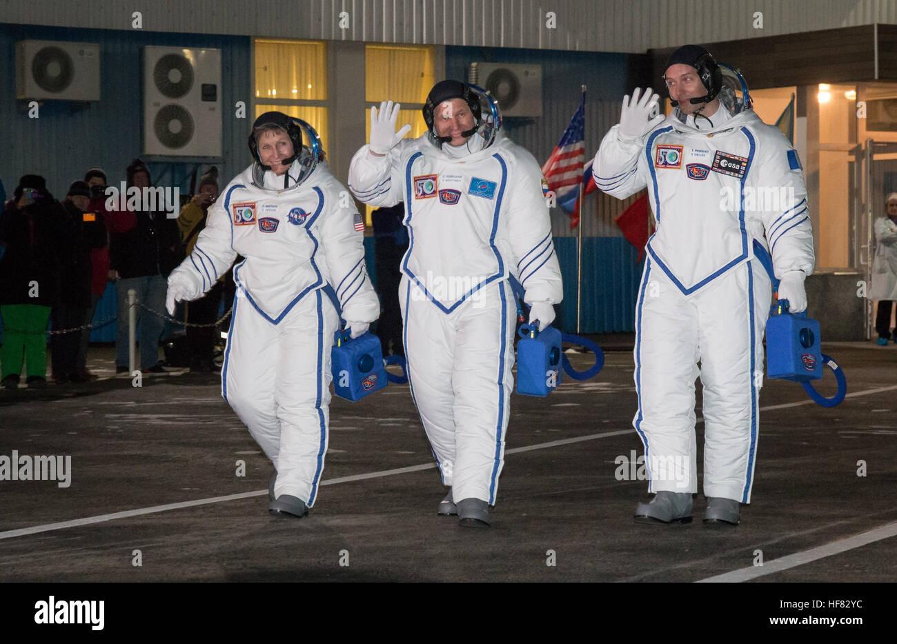 Expedition 50 NASA astronaut Peggy Whitson, left, Russian cosmonaut Oleg Novitskiy of Roscosmos, center, and ESA astronaut Thomas Pesquet  are seen as they depart building 254 a few hours ahead of their launch, Thursday, Nov. 17, 2016, in Baikonur, Kazakhstan.  Whitson, Novitskiy, and Pesquet launched in their Soyuz MS-03 spacecraft to the International Space Station to begin a six-month mission. Victor Zelentsov) Stock Photo