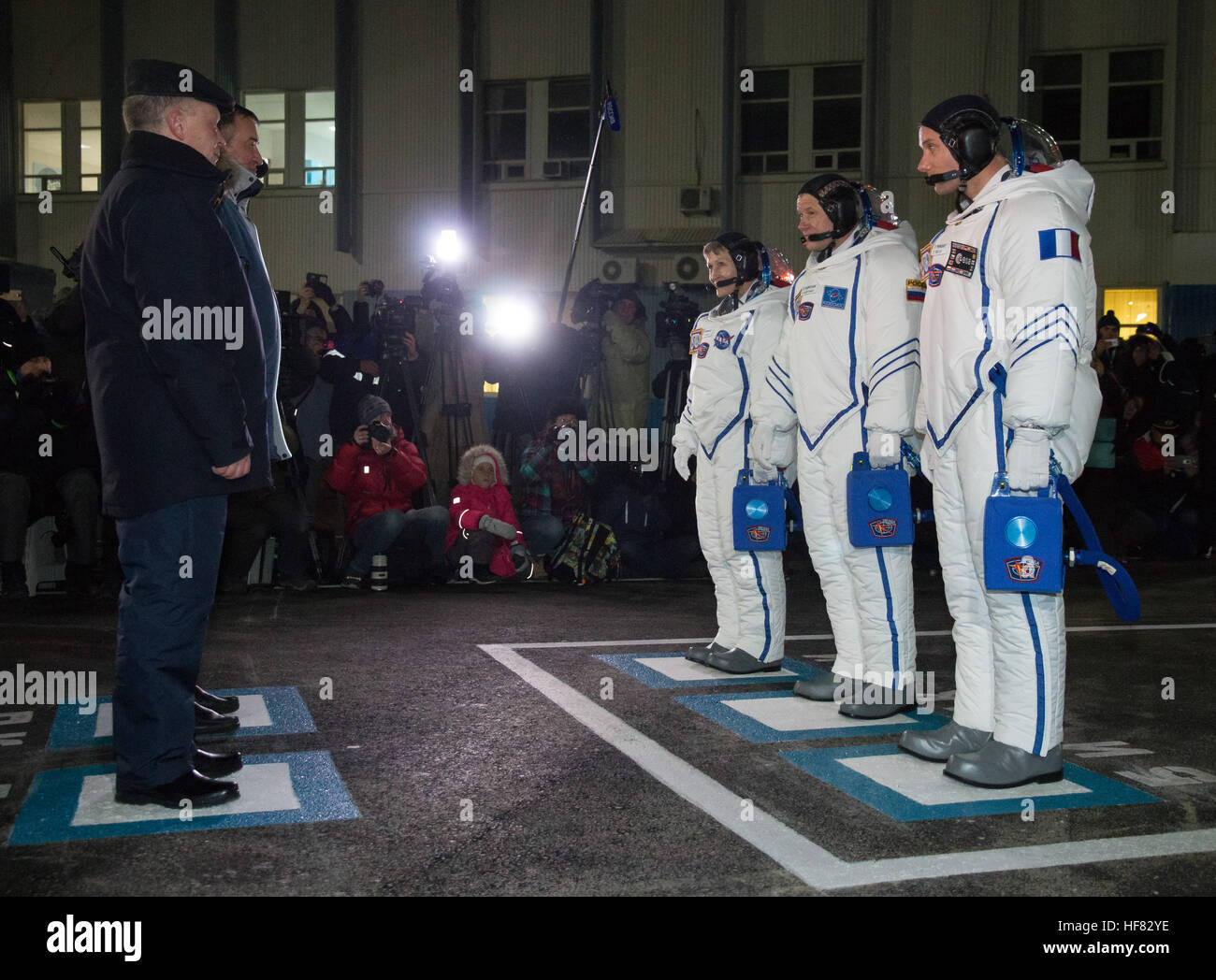 Expedition 50 NASA astronaut Peggy Whitson, left, Russian cosmonaut Oleg Novitskiy of Roscosmos, center, and ESA astronaut Thomas Pesquet  are seen as they depart building 254 and report to mission managers a few hours ahead of their launch, Thursday, Nov. 17, 2016, in Baikonur, Kazakhstan.  Whitson, Novitskiy, and Pesquet launched in their Soyuz MS-03 spacecraft to the International Space Station to begin a six-month mission. Victor Zelentsov) Stock Photo