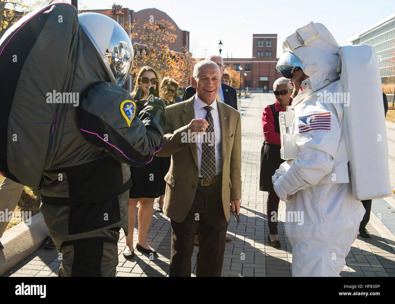 NASA Administrator Charles Bolden speaks with NASA staff in space suits at the Langley Research Center's Centennial float on Thursday, Dec. 1, 2016, at Langley Research Center in Hampton, VA.  While in Hampton, Administrator Bolden also participated in several events highlighting NASA's &quot;human computers&quot; featured in the film &quot;Hidden Figures&quot;. The film stars Taraji P. Henson as Katherine Johnson, the African American mathematician, physicist, and space scientist, who calculated flight trajectories for John Glenn's first orbital flight in 1962. Aubrey Gemignani) Stock Photo
