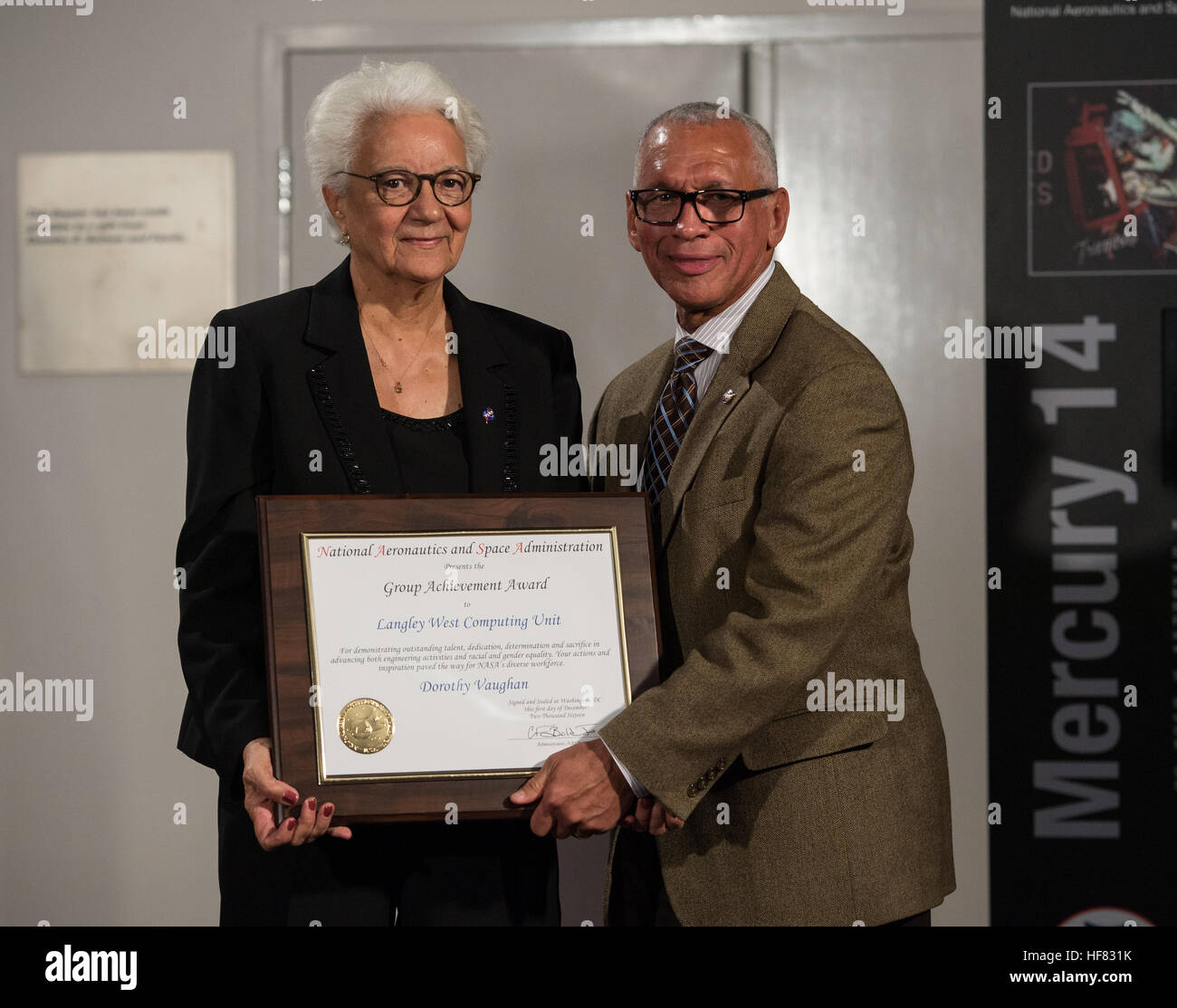 NASA Administrator Charles Bolden Presents An Award To The Family Of nasa-administrator-charles-bolden-presents-an-award-to-the-family-of