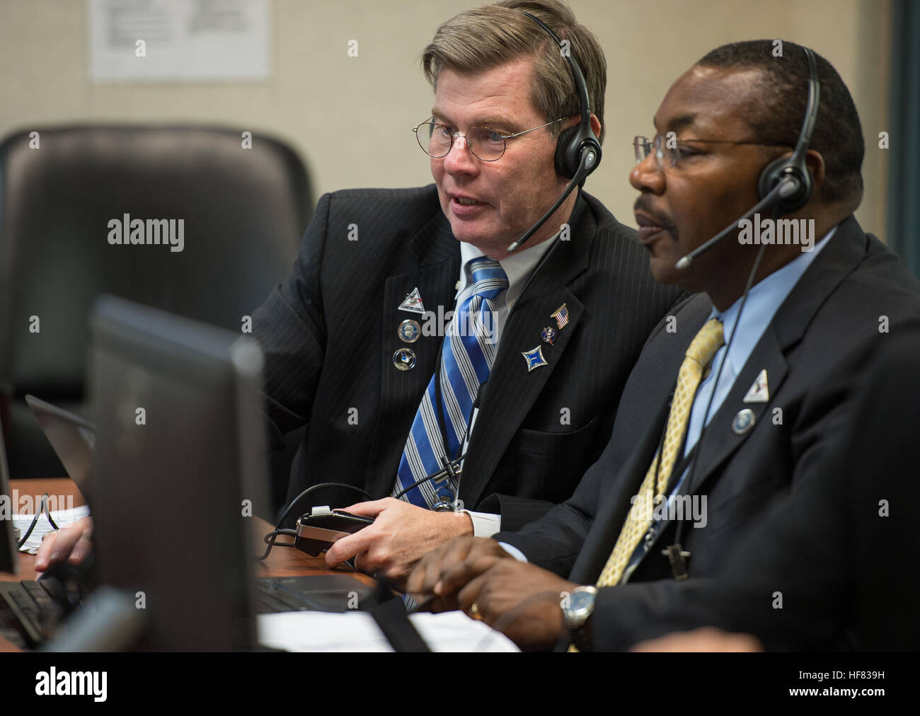 Director of NASA's Launch Services Program in the Human Exploration &amp; Operations Mission Directorate James Norman, left, and Deputy Associate Administrator of NASA's Science Mission Directorate Gregory Robinson, right, monitor the progress of the United Launch Alliance Atlas V rocket carrying NASA's Origins, Spectral Interpretation, Resource Identification, Security-Regolith Explorer (OSIRIS-REx) after launch from the Atlas V Spaceflight Operations Center on Thursday, Sept. 8, 2016 at Cape Canaveral Air Force Station in Florida. OSIRIS-REx will be the first U.S. mission to sample an astero Stock Photo