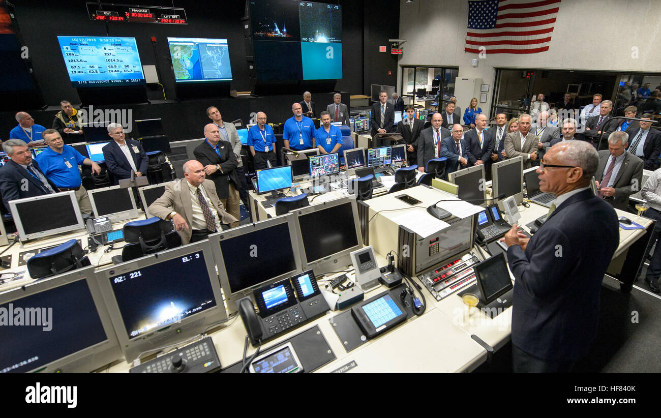 NASA Administrator Charles Bolden congratulates the Orbital ATK Antares rocket, and Cygnus spacecraft launch teams in the Range Control Center at the NASA Wallops Flight Facility after the successful launch, Monday, Oct. 17, 2016 in Virginia. Orbital ATK’s sixth contracted cargo resupply mission with NASA to the International Space Station is delivering over 5,100 pounds of science and research, crew supplies and vehicle hardware to the orbital laboratory and its crew. Stock Photo