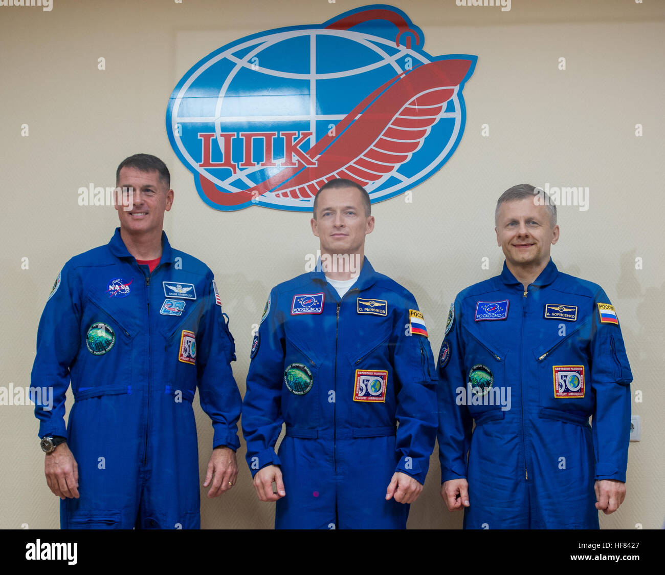 Expedition 49 flight engineer Shane Kimbrough of NASA, left, Soyuz commander Sergey Ryzhikov of Roscosmos, center, and flight engineer Andrey Borisenko of Roscosmos, left, pose for a picture at the conclusion of a crew press conference Tuesday, Oct. 18, 2016 at the Cosmonaut Hotel in Baikonur, Kazakhstan.  Kimbrough, Ryzhikov, and Borisenko are scheduled to launch to the International Space Station aboard the Soyuz MS-02 spacecraft from the Baikonur Cosmodrome on Oct. 19. Stock Photo