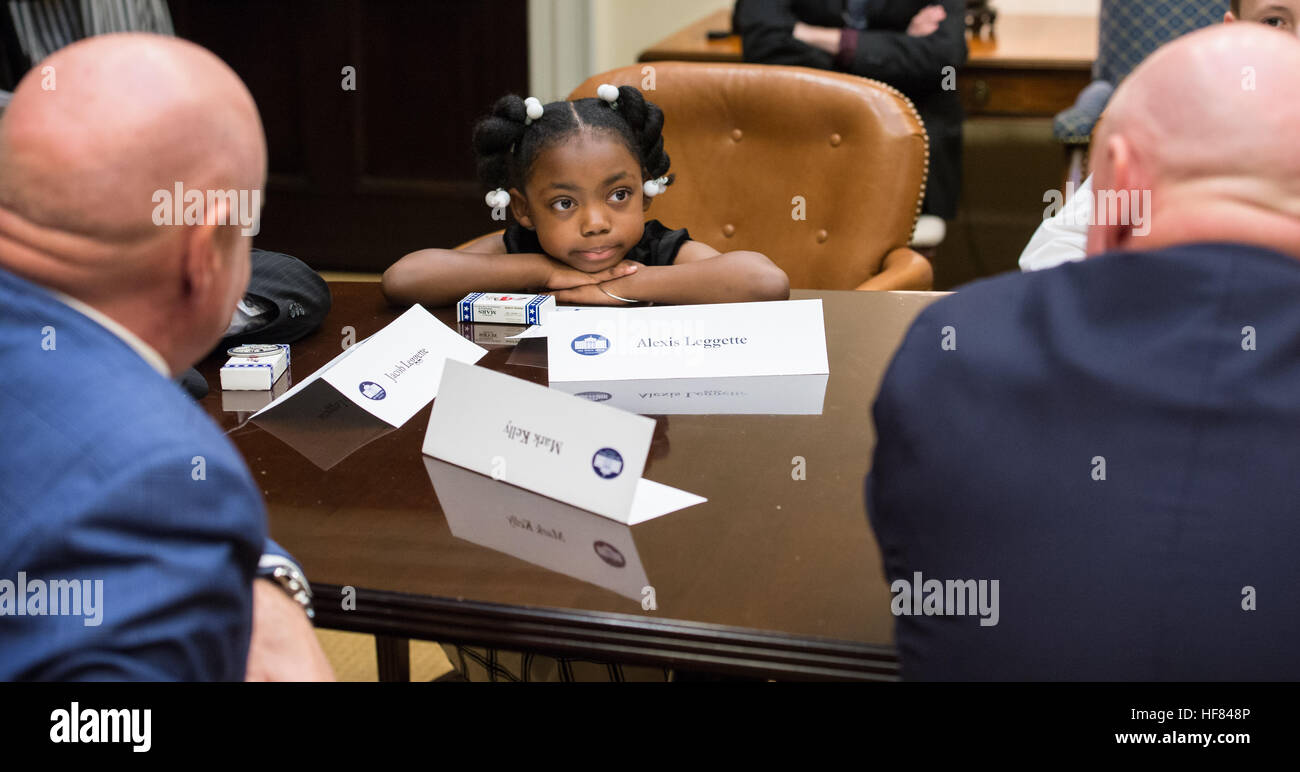 Kid Science Advisor Alexis Leggette participates in a meeting at the White House with astronauts Mark Kelly and Scott Kelly. The event aimed to discuss the importance of science, technology, and innovation, as well as encourage student involvement in STEM education. Stock Photo