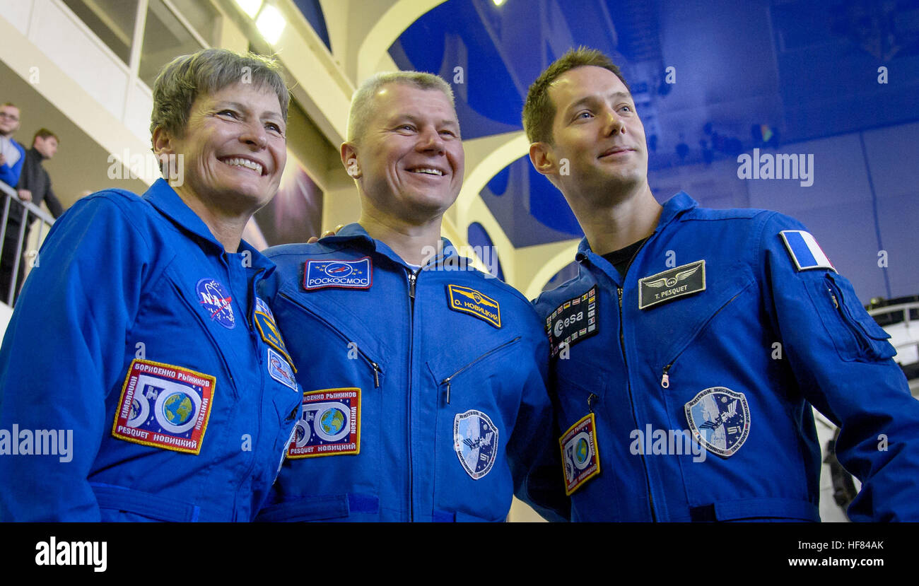 Expedition 50 crew members NASA astronaut Peggy Whitson, left, Russian cosmonaut Oleg Novitskiy of Roscosmos, center, and ESA astronaut Thomas Pesquet pose for a group photograph ahead of their Soyuz qualification exams, Monday, Oct. 24, 2016, at the Gagarin Cosmonaut Training Center (GCTC) in Star City, Russia. Stock Photo
