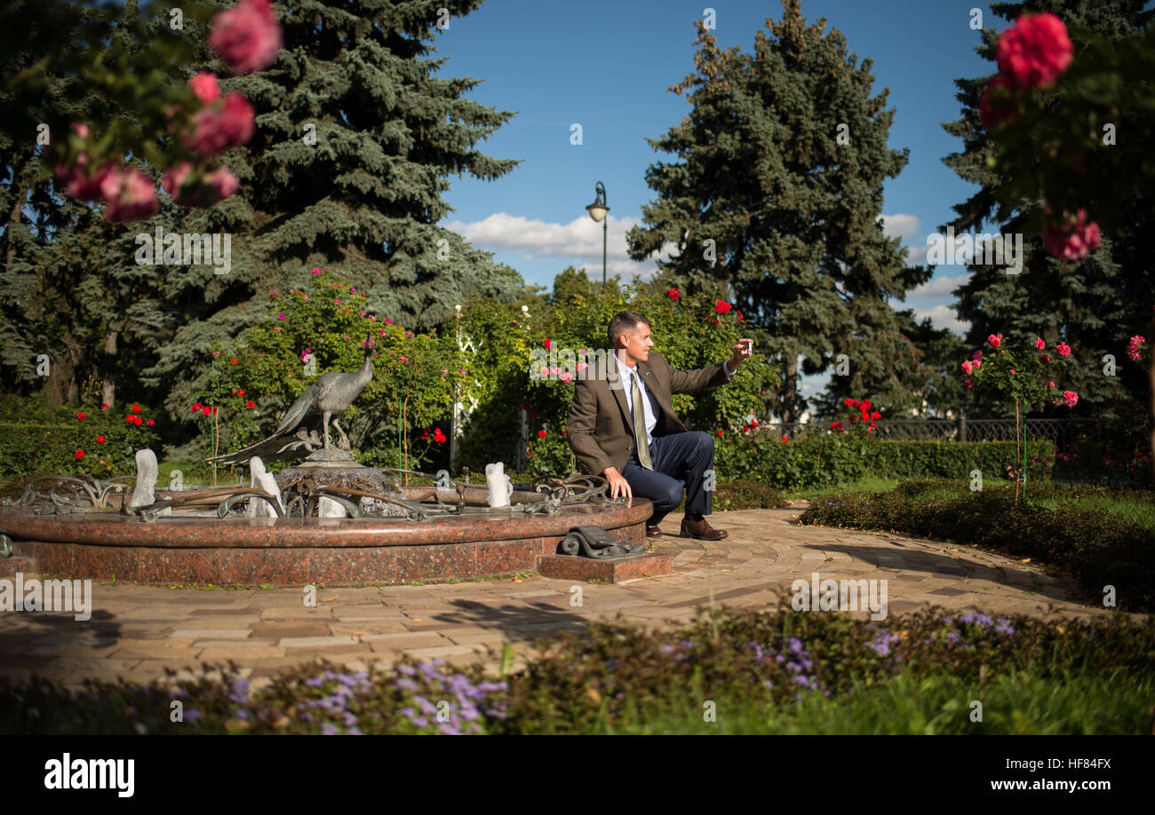 Expedition 49 NASA astronaut Shane Kimbrough makes a self portrait with a peacock statue in the Kremlin gardens after he and his fellow crew members visited Red Square to lay roses at the site where Russian space icons are interred as part of traditional pre-launch ceremonies, Thursday, Sept. 1, 2016 in Moscow. Kimbrough's NASA astronaut class had the call sign of &quot;The Peacocks&quot;. Stock Photo