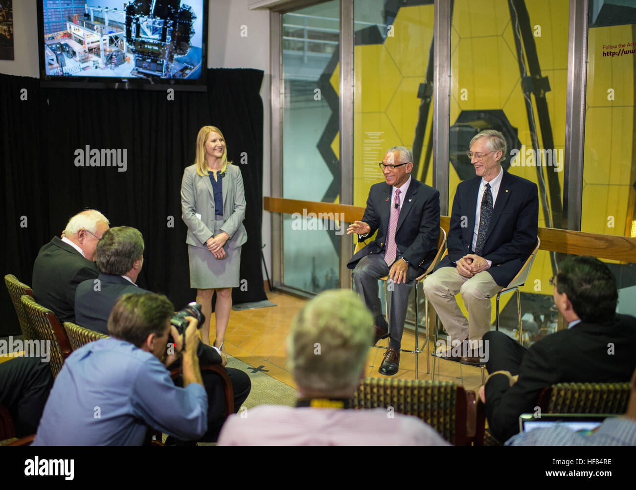 NASA Public Affairs Officer Stephanie Schierholz, left, moderates a question and answer session with NASA Administrator Charles Bolden, second from left, and James Webb Space Telescope Senior Project Scientist John Mather, right, during a media event on Wednesday, Nov. 2, 2016 at NASA's Goddard Spaceflight Center in Greenbelt, Md. The James Webb Space Telescope, the world's largest and most complex space telescope, will study every phase in the history of the universe; from the first luminous glows of the Big Bang, to the formation of planetary systems capable of supporting life, to the evolut Stock Photo