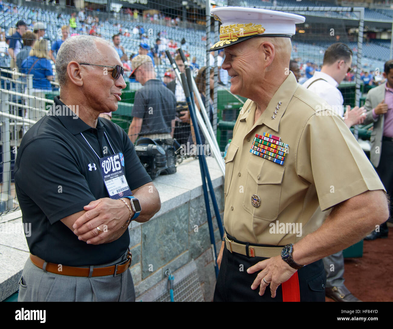 NASA Administrator Charles Bolden, left, speaks with General Robert B. Neller, commandant of the United States Marine Corps before the start of a baseball game between the Los Angeles Dodgers and the Washington Nationals, Wednesday, July 20, 2016 at Nationals Park in Washington. Stock Photo