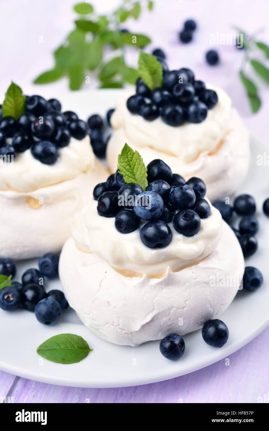Pavlova meringue cakes with blueberries, summer dessert Stock Photo Alamy