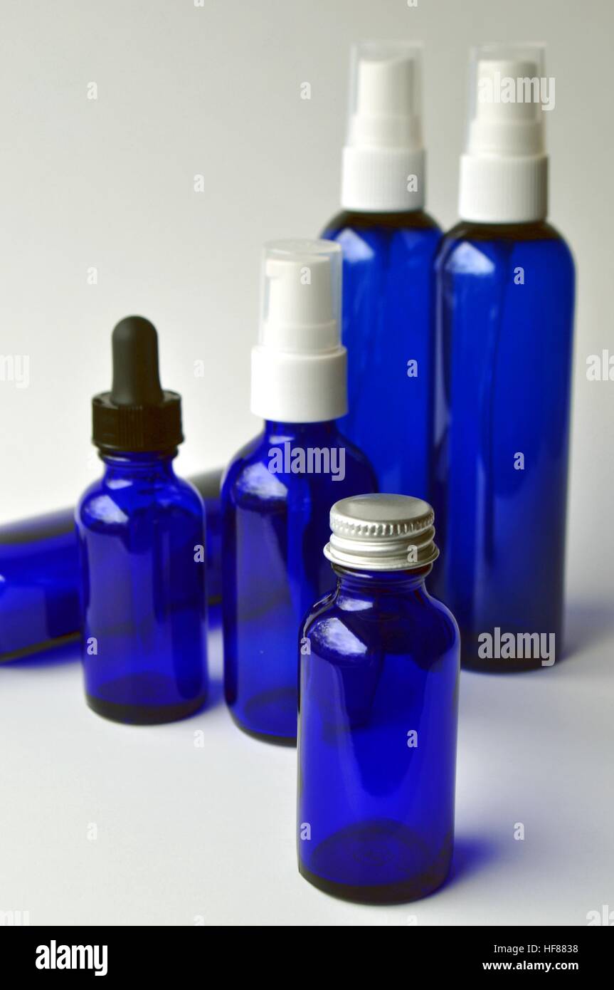Download Group Of Dark Blue Glass Bottles And Jars For Cosmetic Oils Beauty Serums Laboratory Liquids Essential Oils Isolated On White With Copy Space Stock Photo Alamy