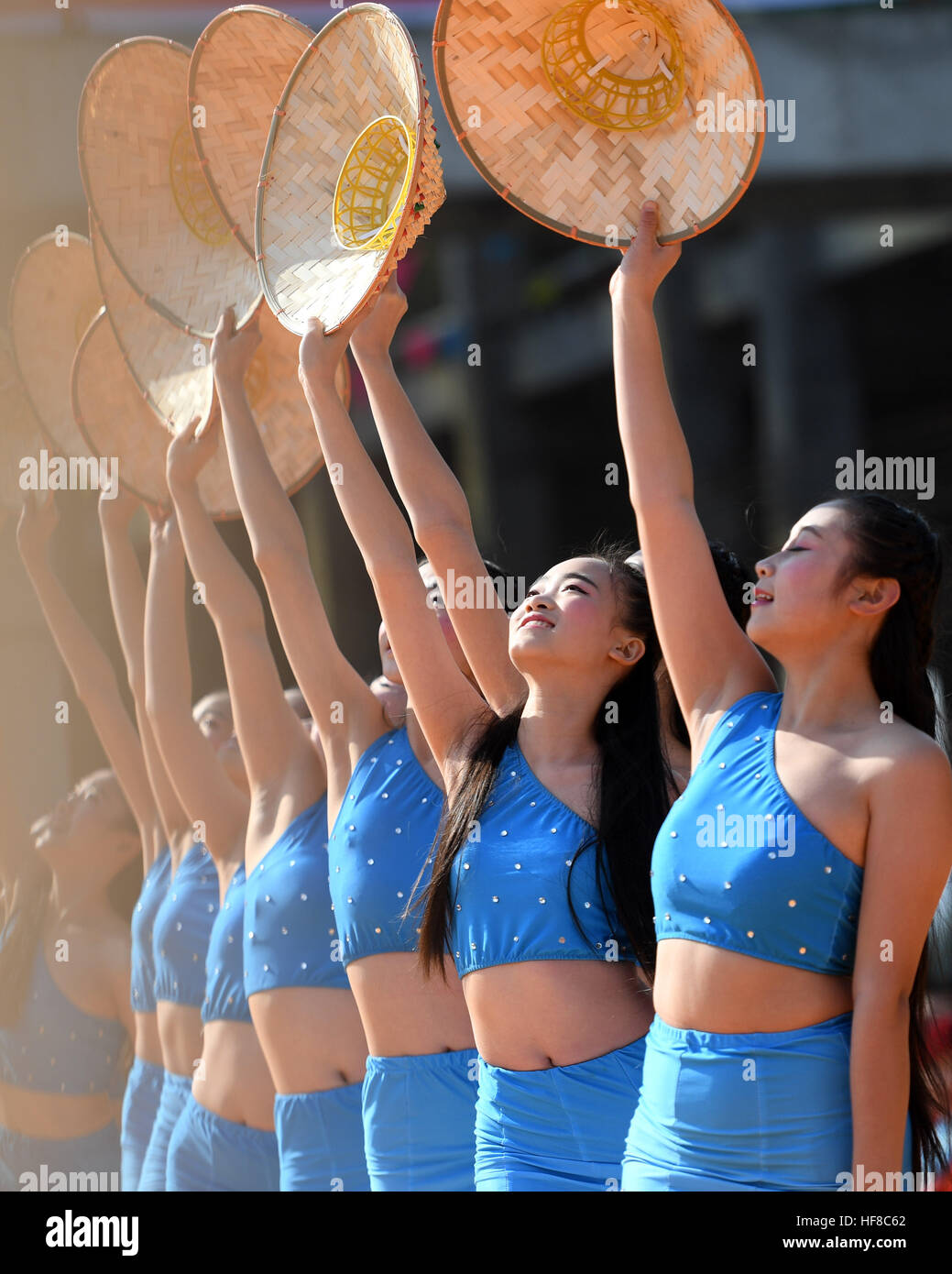 Rongan, China's Guangxi Zhuang Automonous Region. 28th Dec, 2016. Women perform in Chang'an Township in Rong'an County, south China's Guangxi Zhuang Automonous Region, Dec. 28, 2016. A celebration was held for the harvest of kumquat fruit here on Wednesday. © Lu Bo'an/Xinhua/Alamy Live News Stock Photo